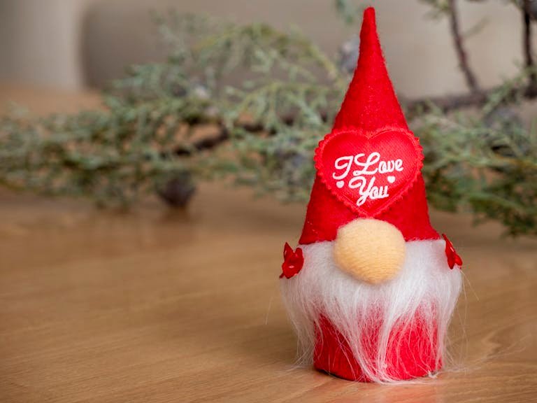 Adorable red gnome with 'I Love You' text, perfect for holiday decoration.